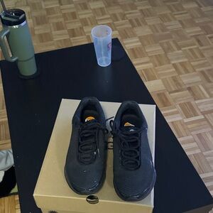 Nike Black Sneakers with Orange Accents